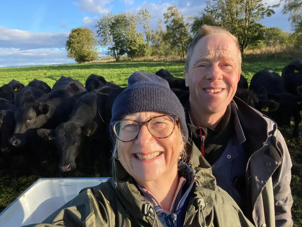 Matt and Lucy Tile with their cattle in the field at Bairnkine Farm